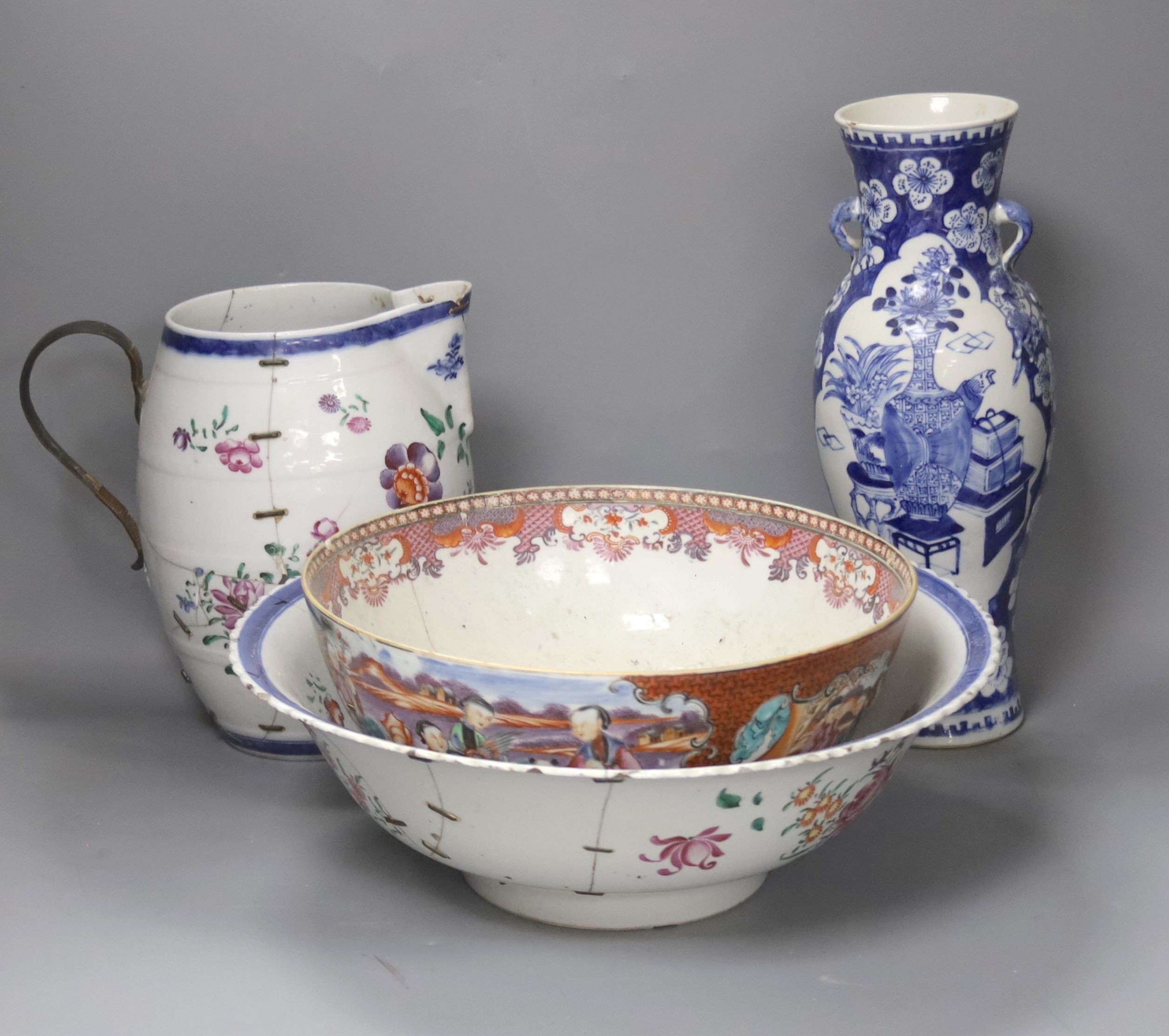 A Chinese Jiaqing export porcelain toilet jug and basin, a small punch bowl, and a blue and white vase (all a.f.) 31cm